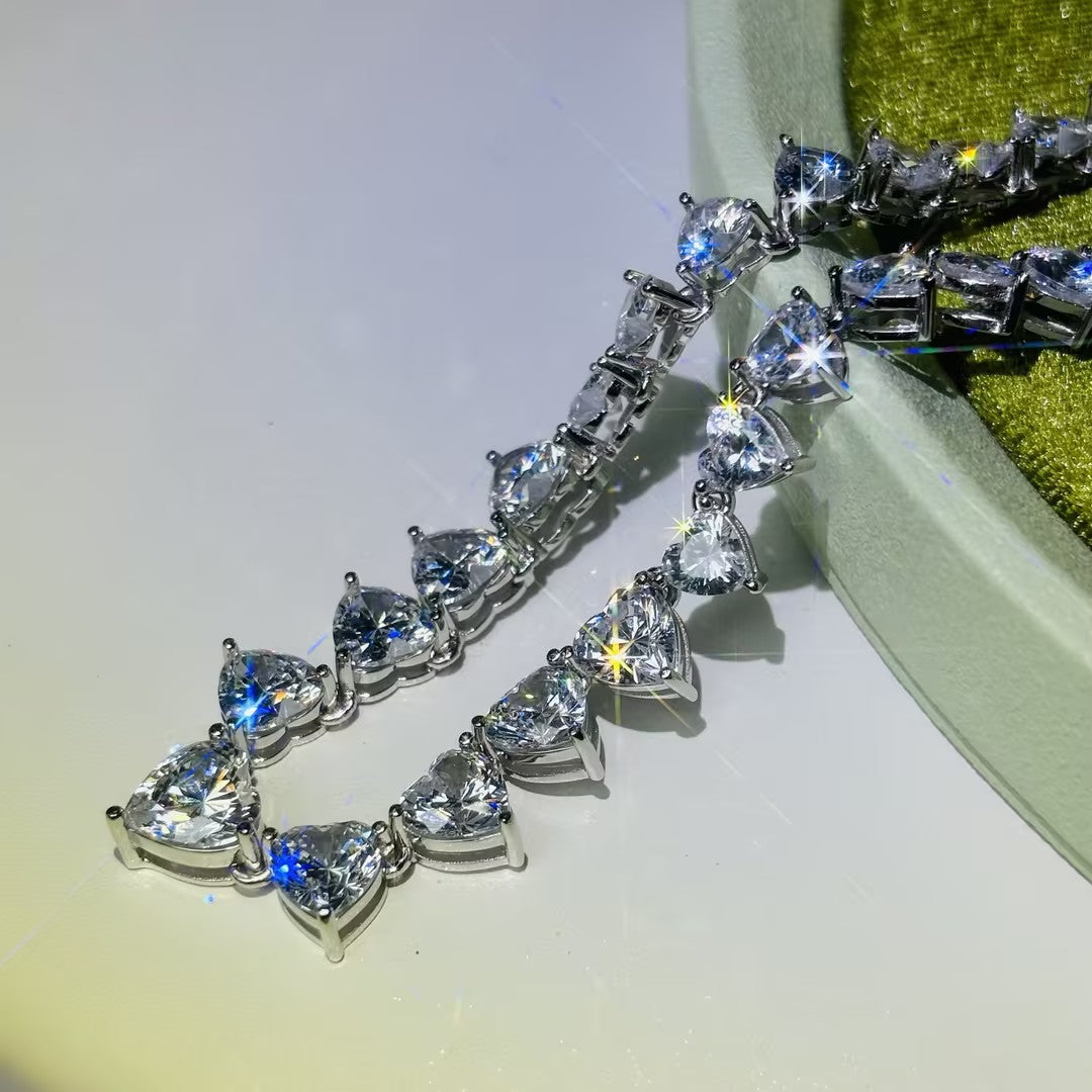 A collection of tennis necklaces with various cut gemstones