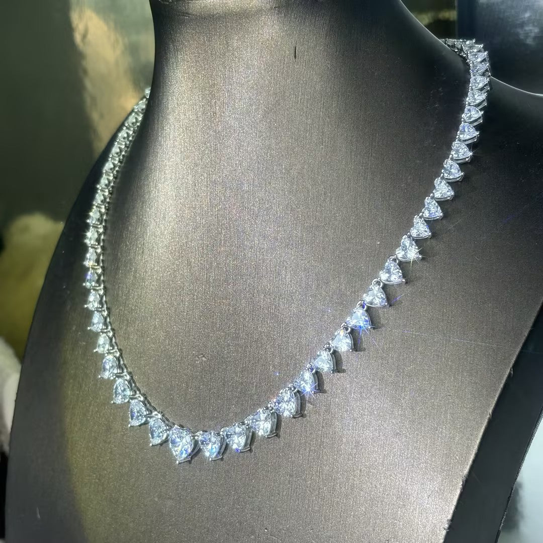 A collection of tennis necklaces with various cut gemstones