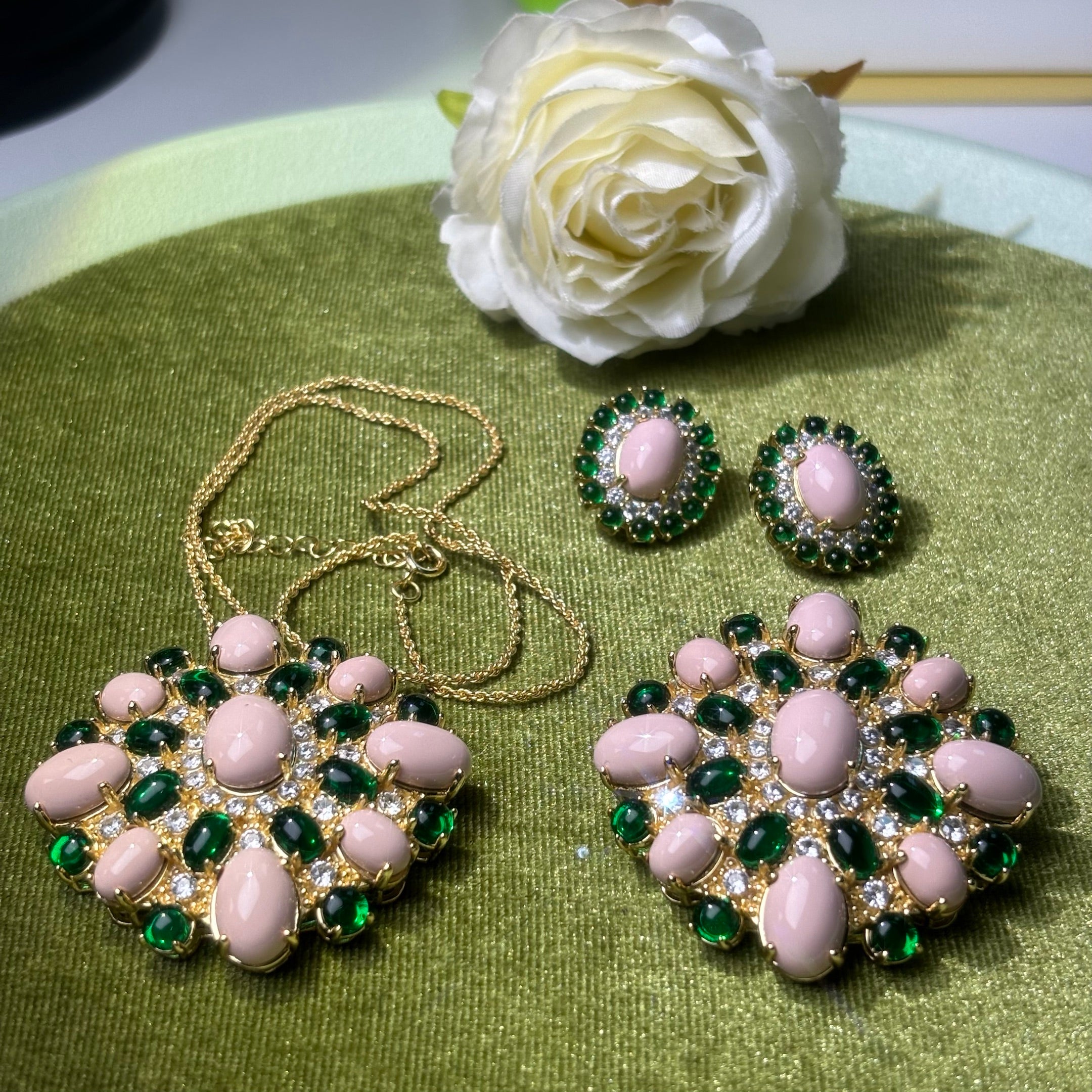 A unique turquoise and gemstone brooch, earrings, and pendant set