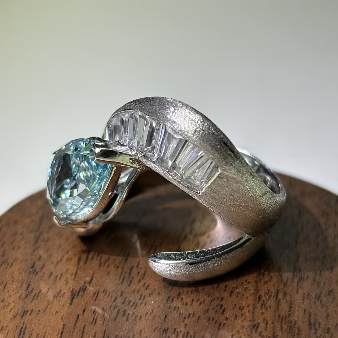 4Ctw Pear-shaped and rectangular gemstone rings