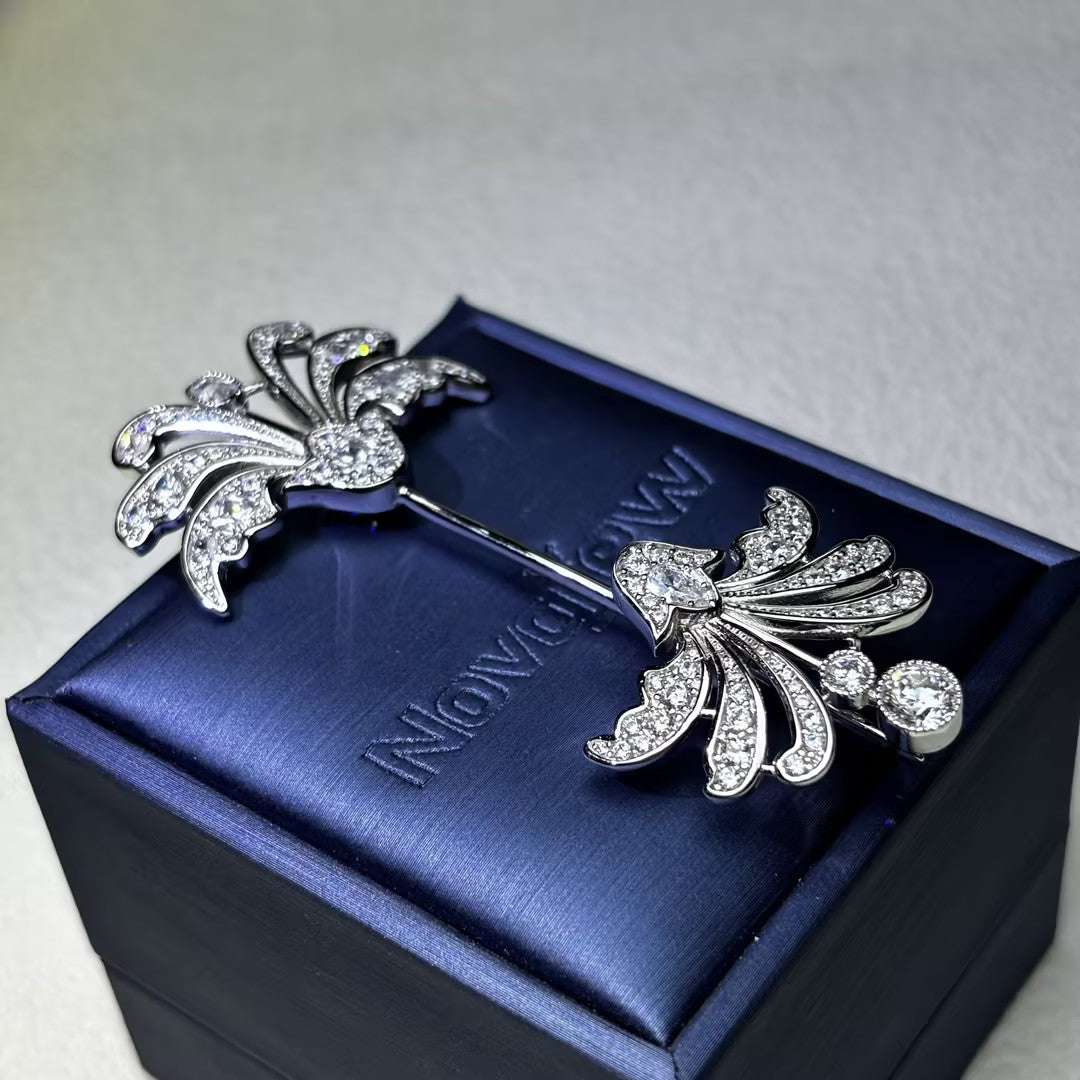 Decorative antique-cut brooch with gemstones at both ends