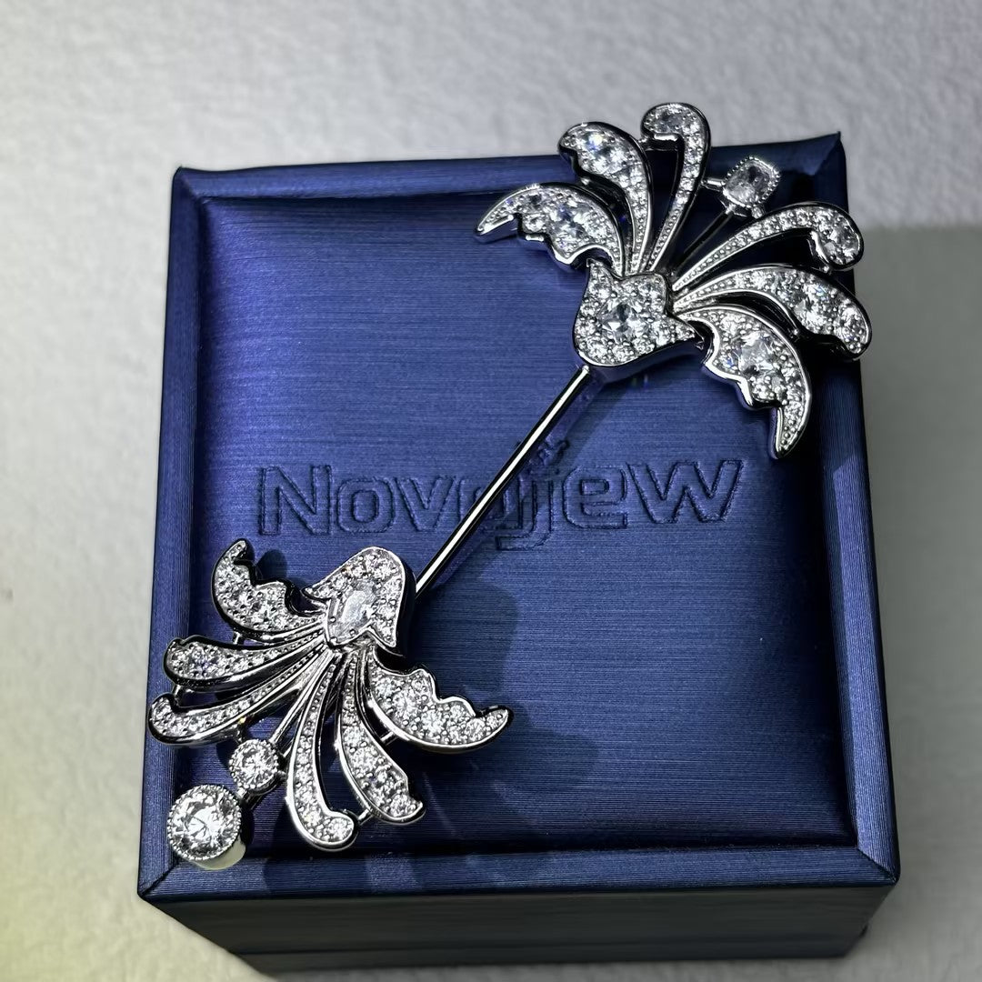 Decorative antique-cut brooch with gemstones at both ends