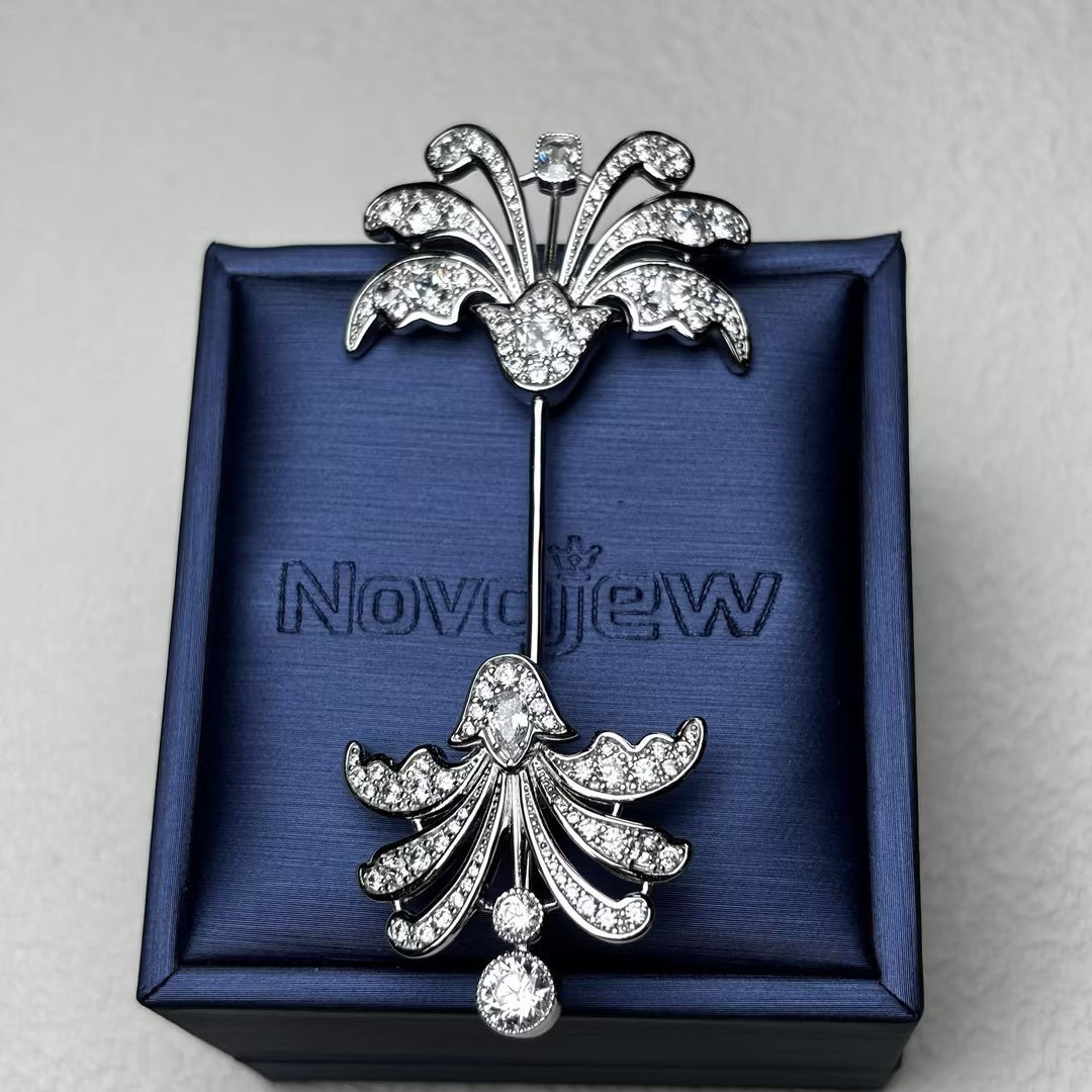 Decorative antique-cut brooch with gemstones at both ends