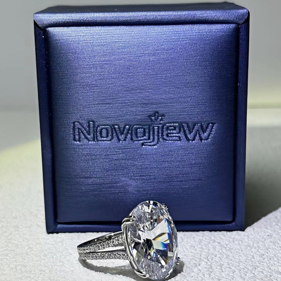 11Ct sparkling oval gemstone forked handle engagement ring