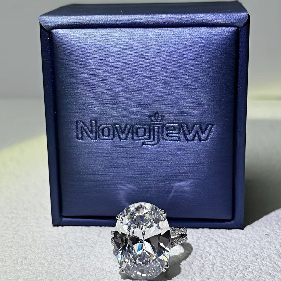 11Ct sparkling oval gemstone forked handle engagement ring